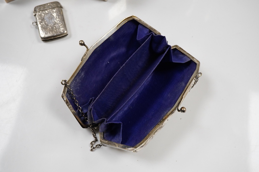 An Edwardian silver vesta case, Birmingham, 1902, 42mm, together with a small Indian white metal box, a pair of white metal Soviet? candlesticks, a plated purse, a plated belt, a hexagonal box and cover stamped MMA and a
